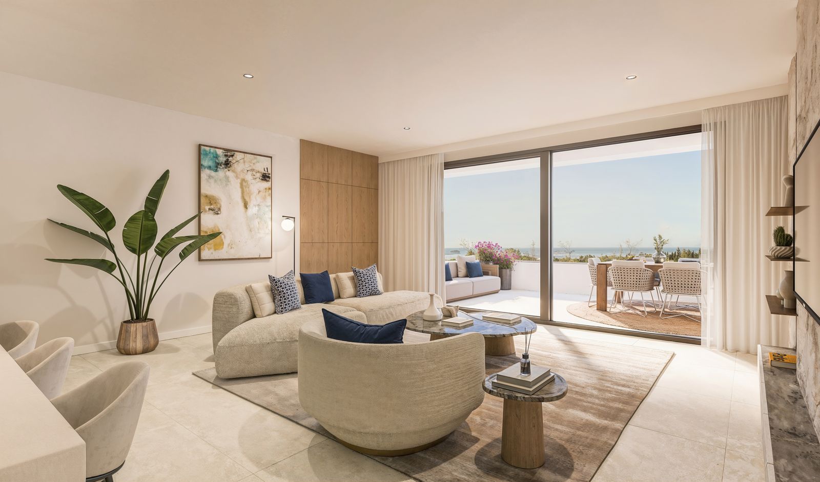 Modern living room with ocean view, large windows, and indoor-outdoor seating.